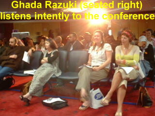 Ghada (right) listens intently.